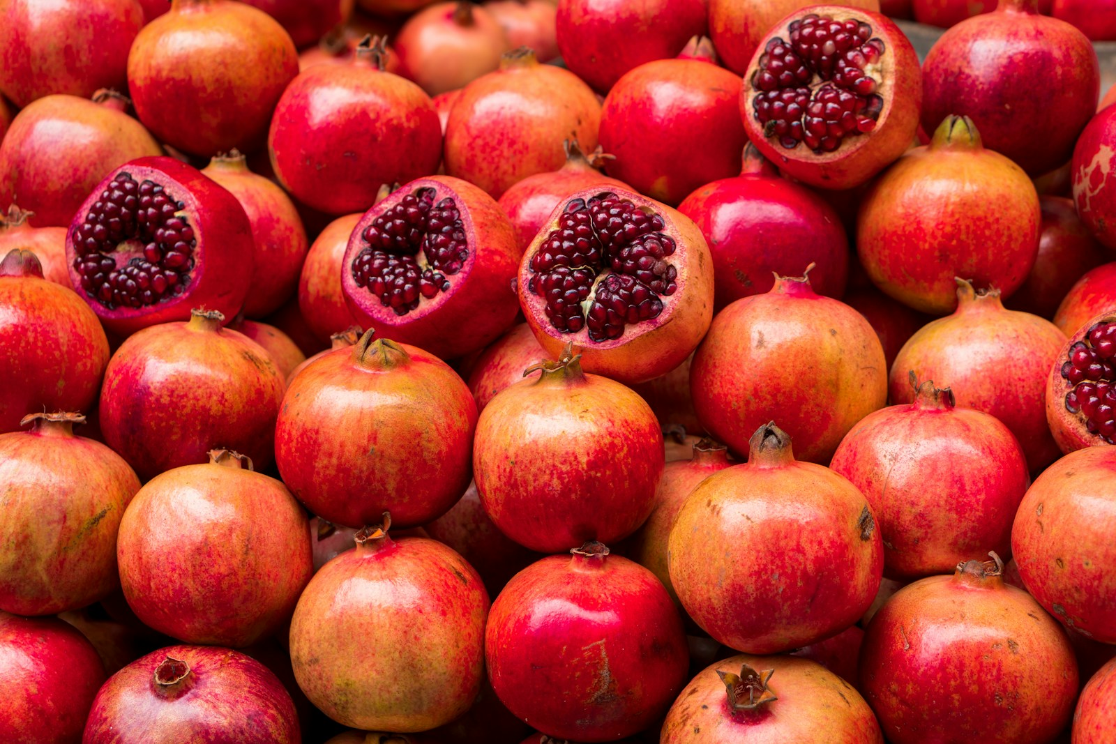 Fresh pomegranate fruit displayed for grading